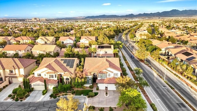 aerial view of residential area featuring a mountainous background