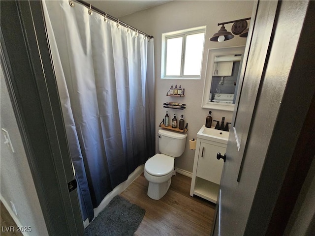 full bathroom with toilet, wood finished floors, vanity, and a shower with curtain