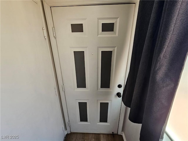 doorway to outside with wood finished floors