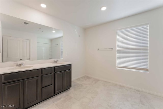2824 Mozia Ct, Henderson, NV 89044 - full bath with double vanity, a shower, baseboards, and recessed lighting