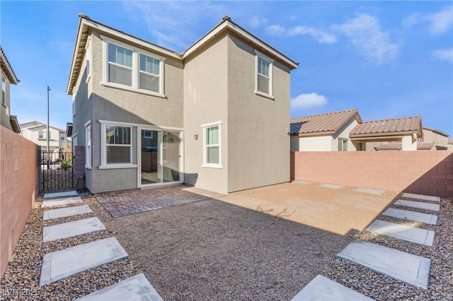 2824 Mozia Ct, Henderson, NV 89044 - back of property with stucco siding, a fenced backyard, and a patio area