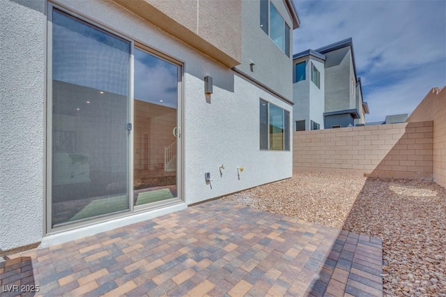 view of patio / terrace featuring fence