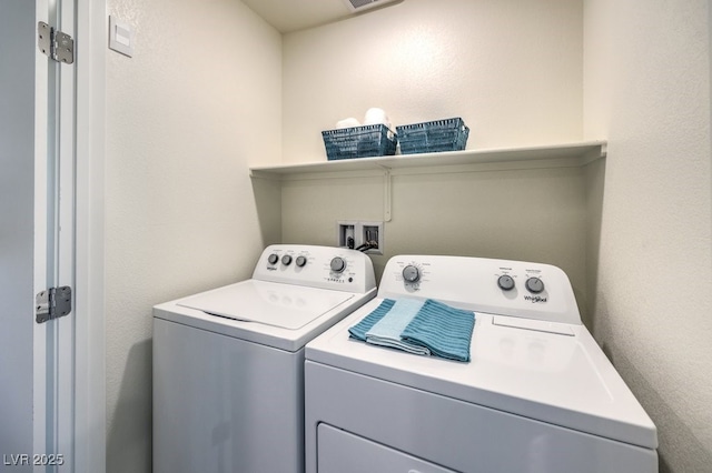 washroom featuring washer and clothes dryer