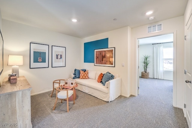 living room featuring carpet, baseboards, and recessed lighting