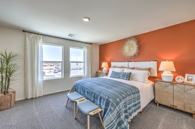carpeted bedroom featuring baseboards