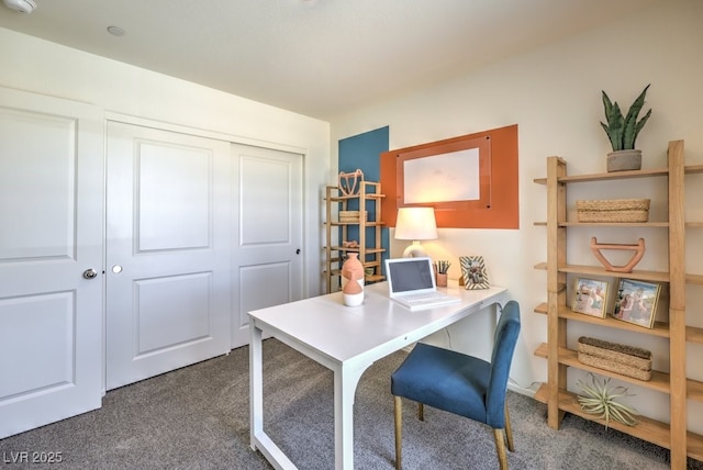 home office featuring dark colored carpet