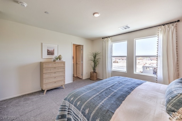 carpeted bedroom featuring baseboards