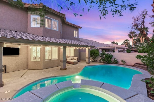 9615 Sedona Hills Ct, Las Vegas, NV 89147 - view of pool featuring a patio area, a pool with connected hot tub, and fence