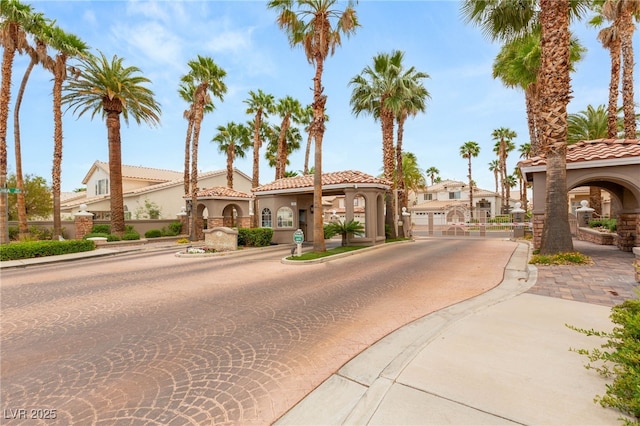 9615 Sedona Hills Ct, Las Vegas, NV 89147 - view of street with curbs, a gated entry, sidewalks, and a gate