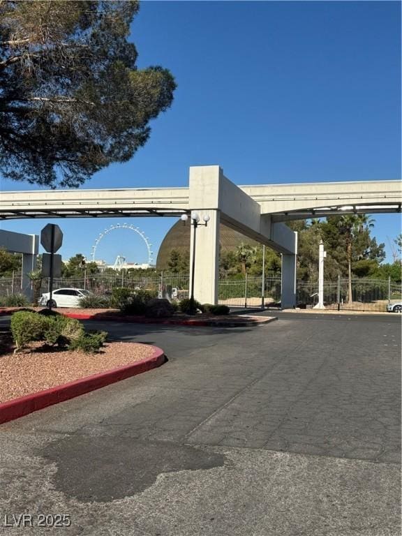 view of parking featuring fence