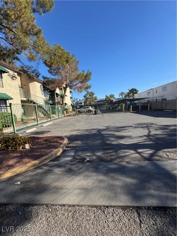 view of asphalt road featuring a residential view