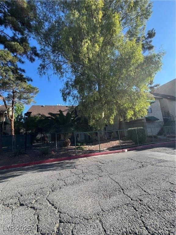 obstructed view of property with a fenced front yard