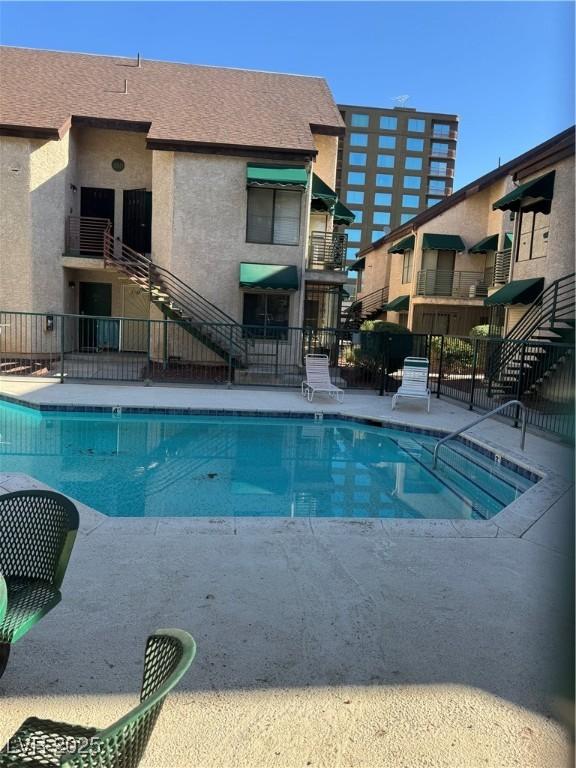 community pool with fence