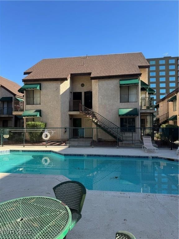 community pool featuring fence