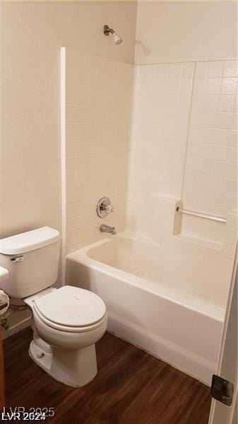 full bathroom with wood finished floors, toilet, and  shower combination