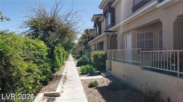 view of side of property with stucco siding