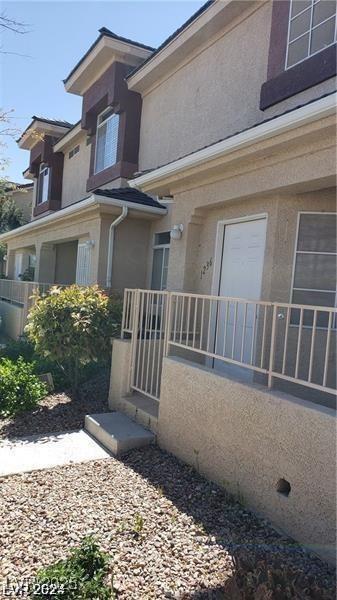 view of side of property with stucco siding