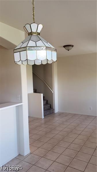 staircase with tile patterned floors