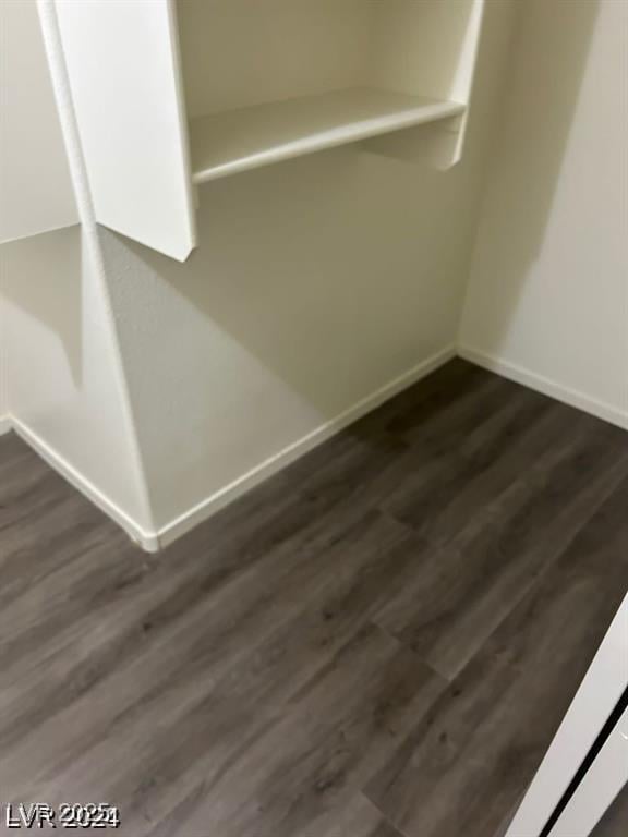 detailed view of baseboards and wood finished floors