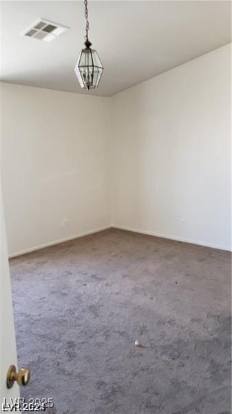 unfurnished room with carpet flooring and baseboards