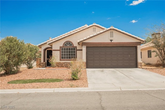 2860 Galena Peak Ln, Las Vegas, NV 89156 - view of front facade featuring an attached garage, stucco siding, driveway, stone siding, and a tiled roof