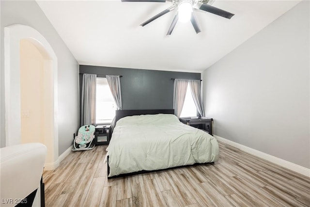 2860 Galena Peak Ln, Las Vegas, NV 89156 - bedroom featuring light wood-style flooring, baseboards, a ceiling fan, and lofted ceiling