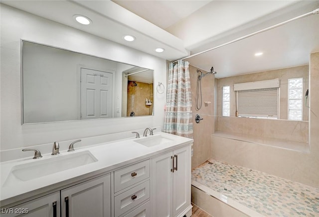6771 Shelter Ln, Las Vegas, NV 89103 - bathroom with a tile shower, recessed lighting, and double vanity