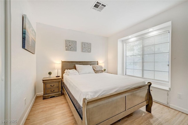 6771 Shelter Ln, Las Vegas, NV 89103 - bedroom with light wood-type flooring, baseboards, and recessed lighting