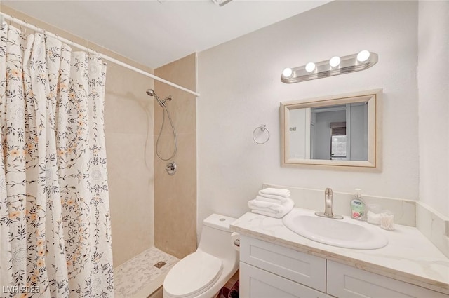 6771 Shelter Ln, Las Vegas, NV 89103 - bathroom with a tile shower, vanity, and toilet