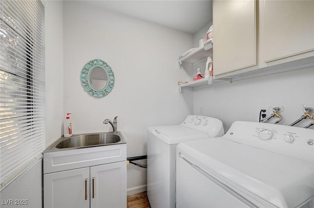6771 Shelter Ln, Las Vegas, NV 89103 - clothes washing area with washing machine and dryer, cabinet space, wood finished floors, and baseboards