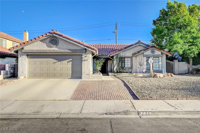 6771 Shelter Ln, Las Vegas, NV 89103 - view of front of property with an attached garage, driveway, stucco siding, and a tiled roof