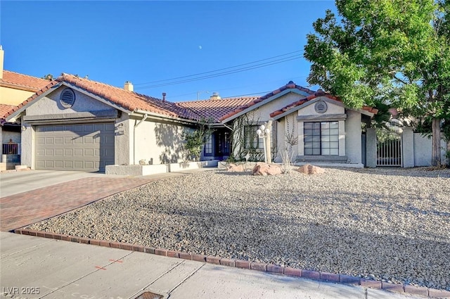 6771 Shelter Ln, Las Vegas, NV 89103 - single story home with a garage, a tiled roof, driveway, stucco siding, and a chimney