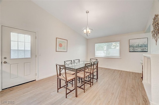 6771 Shelter Ln, Las Vegas, NV 89103 - dining room with light wood-style flooring, vaulted ceiling, baseboards, and a chandelier