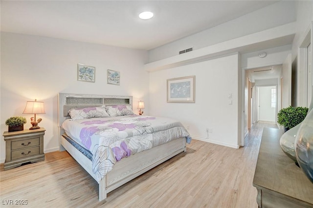 6771 Shelter Ln, Las Vegas, NV 89103 - bedroom with light wood finished floors and baseboards