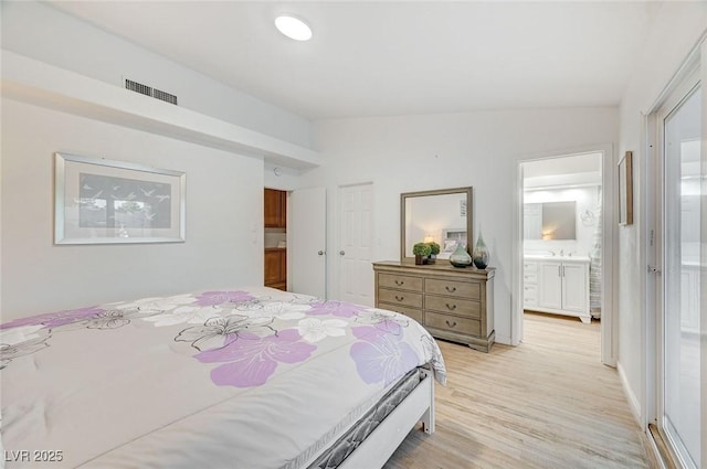 6771 Shelter Ln, Las Vegas, NV 89103 - bedroom featuring light wood-style floors and ensuite bathroom