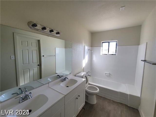 bathroom with wood finished floors, toilet, shower / tub combination, and double vanity