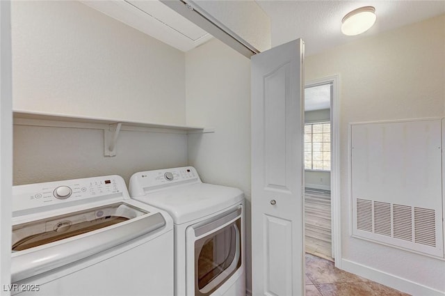 2633 S Durango Dr Unit 201, Las Vegas, NV 89117 - clothes washing area with washing machine and dryer and baseboards