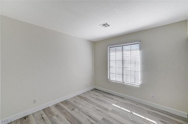 2633 S Durango Dr Unit 201, Las Vegas, NV 89117 - empty room featuring light wood finished floors and baseboards