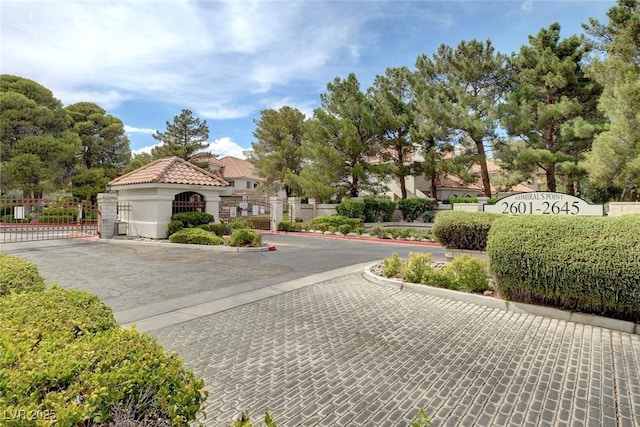 2633 S Durango Dr Unit 201, Las Vegas, NV 89117 - view of street featuring a gate, curbs, and a gated entry