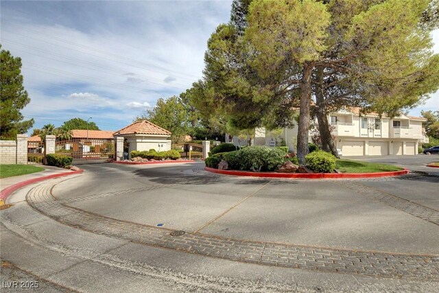 2633 S Durango Dr Unit 201, Las Vegas, NV 89117 - view of front of property featuring a gate and driveway