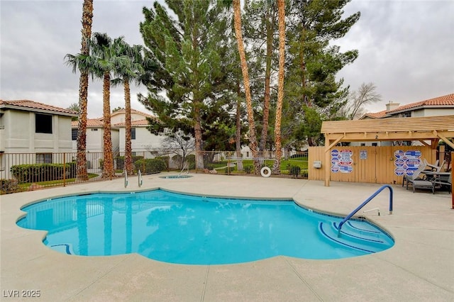 2633 S Durango Dr Unit 201, Las Vegas, NV 89117 - community pool with fence, a patio area, and a community hot tub