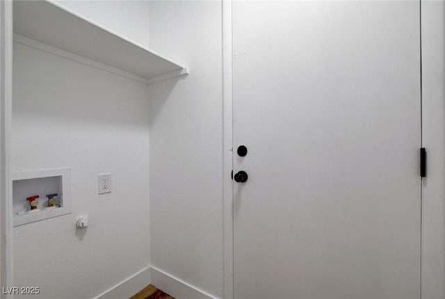 laundry room featuring hookup for a washing machine, baseboards, and dark wood-style floors
