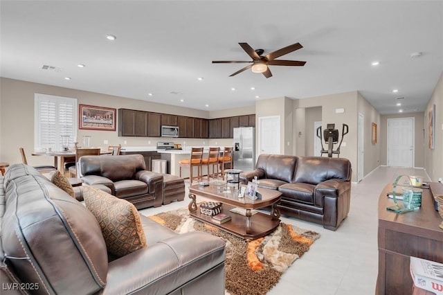 3556 Valley Lily St, North Las Vegas, NV 89032 - living area with a ceiling fan, recessed lighting, light tile patterned flooring, and baseboards