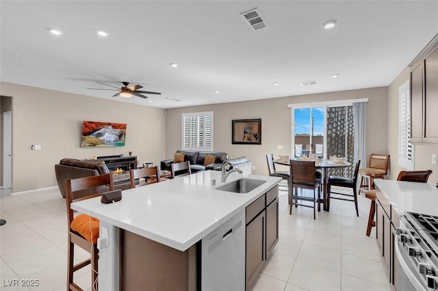 3556 Valley Lily St, North Las Vegas, NV 89032 - kitchen featuring a sink, appliances with stainless steel finishes, light countertops, open floor plan, and recessed lighting