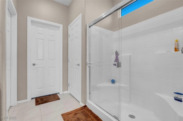 3556 Valley Lily St, North Las Vegas, NV 89032 - bathroom with a stall shower, tile patterned flooring, and baseboards