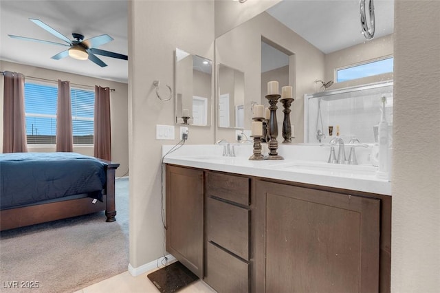 3556 Valley Lily St, North Las Vegas, NV 89032 - ensuite bathroom featuring a ceiling fan, plenty of natural light, double vanity, and a shower with door
