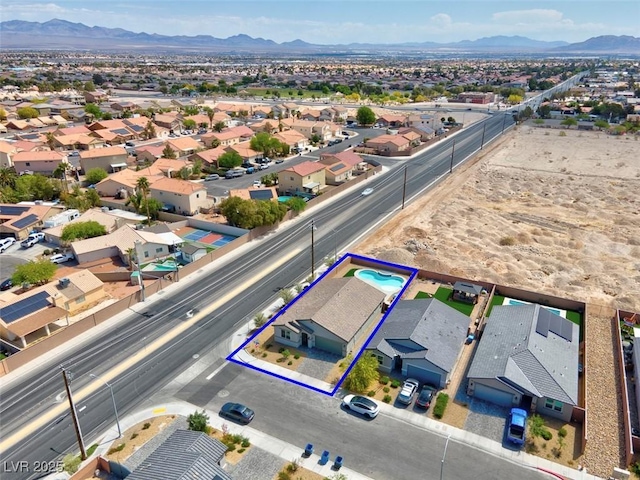 3556 Valley Lily St, North Las Vegas, NV 89032 - aerial perspective of suburban area with a mountain backdrop and property boundaries highlighted