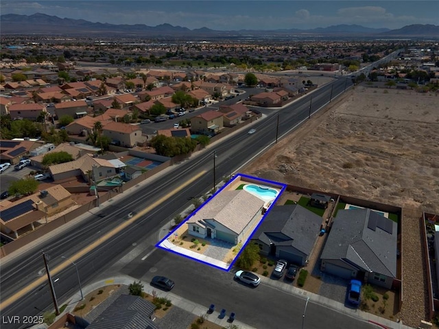 3556 Valley Lily St, North Las Vegas, NV 89032 - aerial perspective of suburban area with a mountain backdrop and property parcel outlined