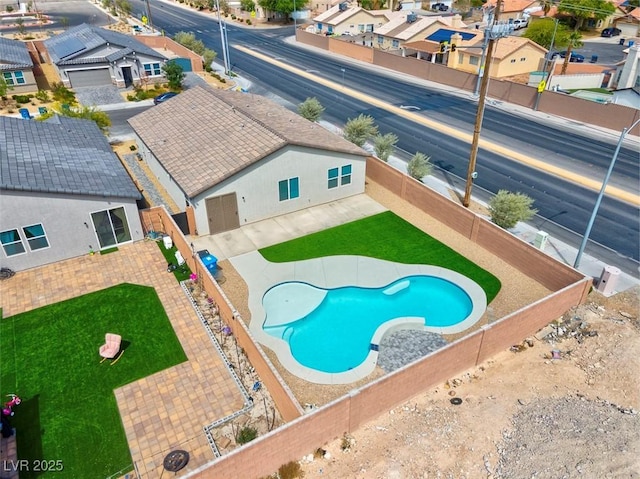 3556 Valley Lily St, North Las Vegas, NV 89032 - view of swimming pool featuring a residential view and a fenced backyard