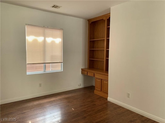 9236 Canalino Dr, Las Vegas, NV 89134 - spare room featuring dark wood finished floors and baseboards